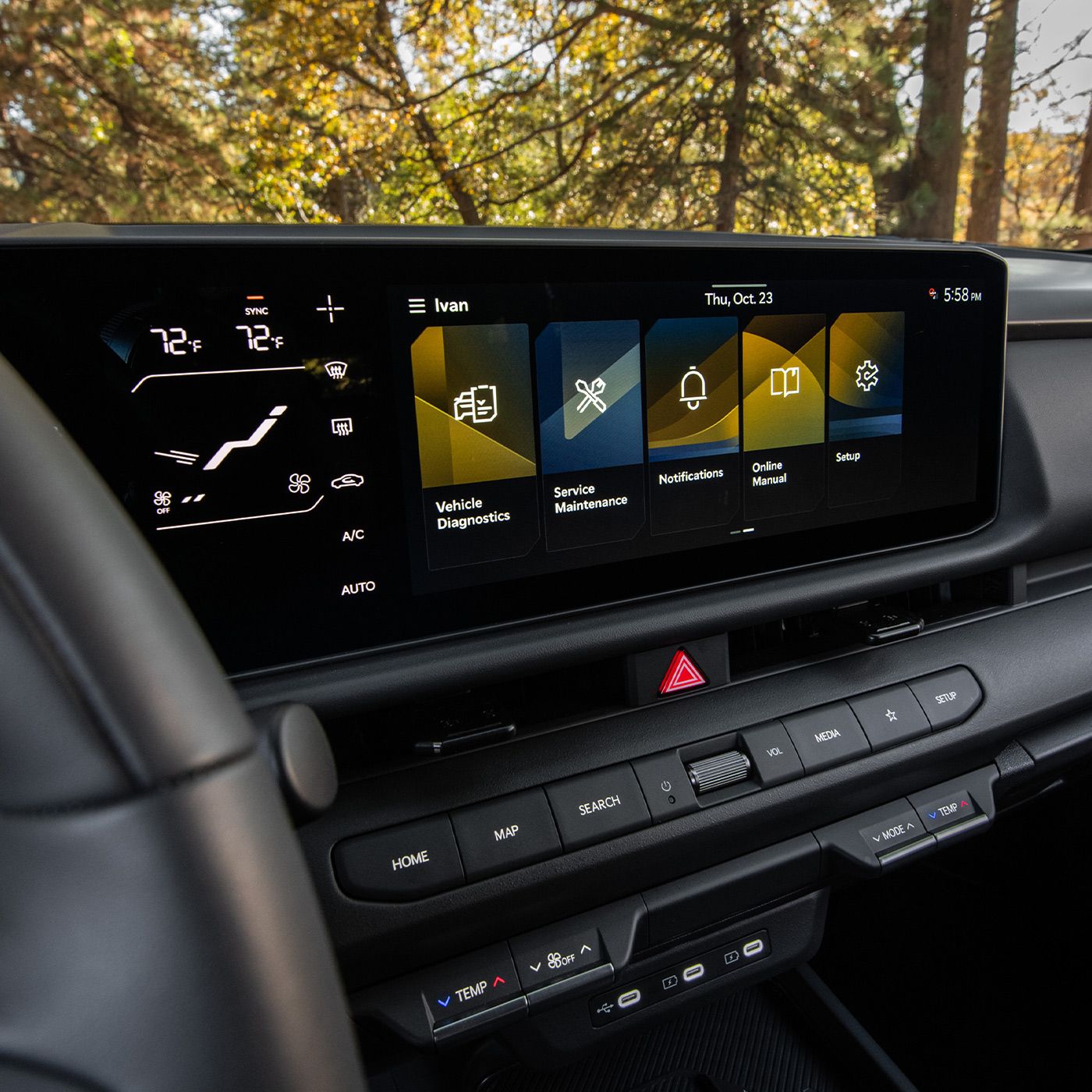 Close-up interior shot of 2027 Kia Sportage Hybrid with a premium black cabin, featuring a large touchscreen digital display and modern dashboard, with a glimpse of a tree visible through the windshield.