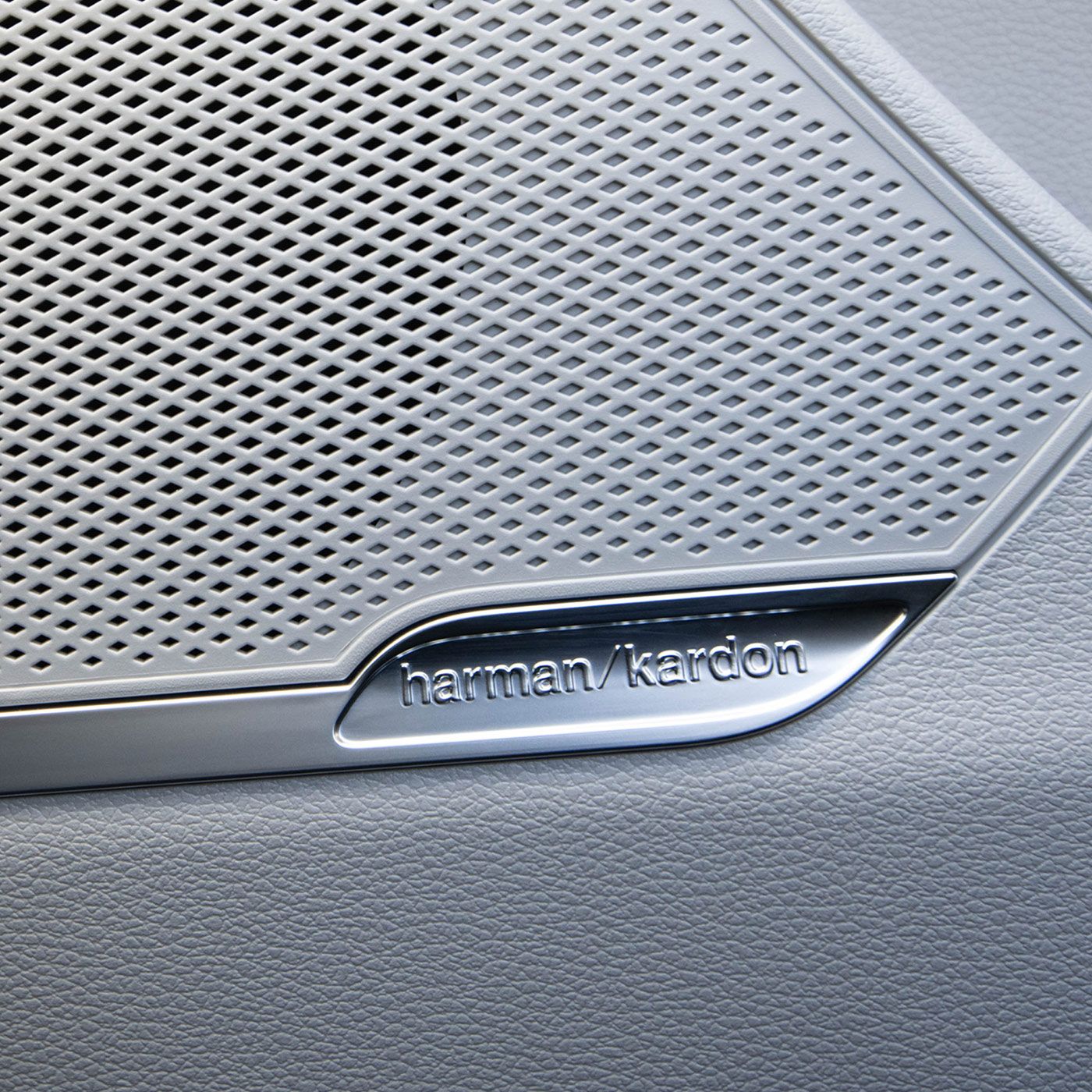 Close-up interior shot of the grey 2027 Kia Sportage Hybrid SUV's Harman Kardon premium audio system that delivers reliable audio features.