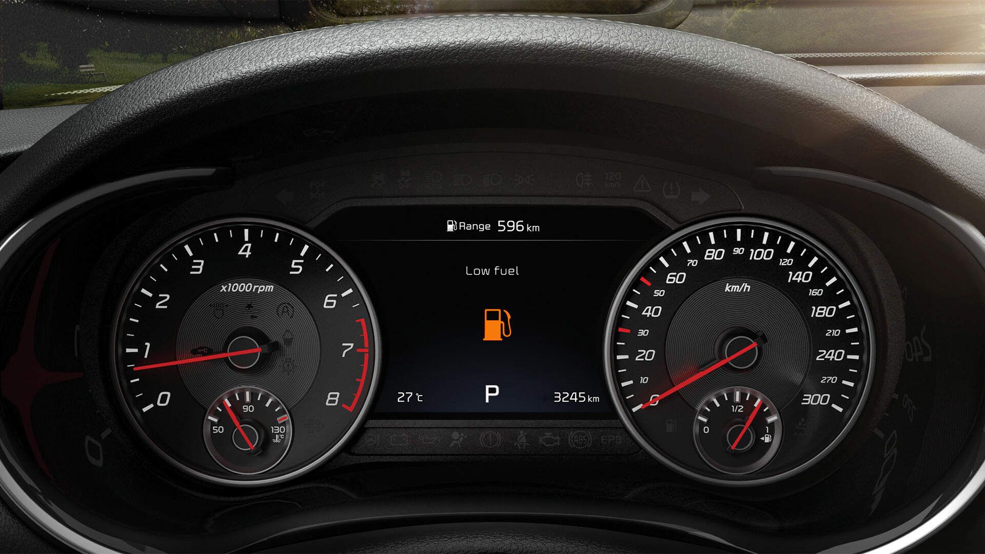 Cluster showing Low Fuel warning light