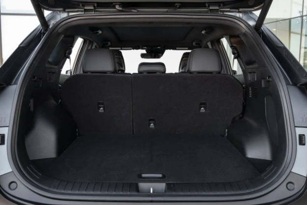 2024 Kia Sportage Plug-in Hybrid back view of the open trunk featuring a spacious storage space