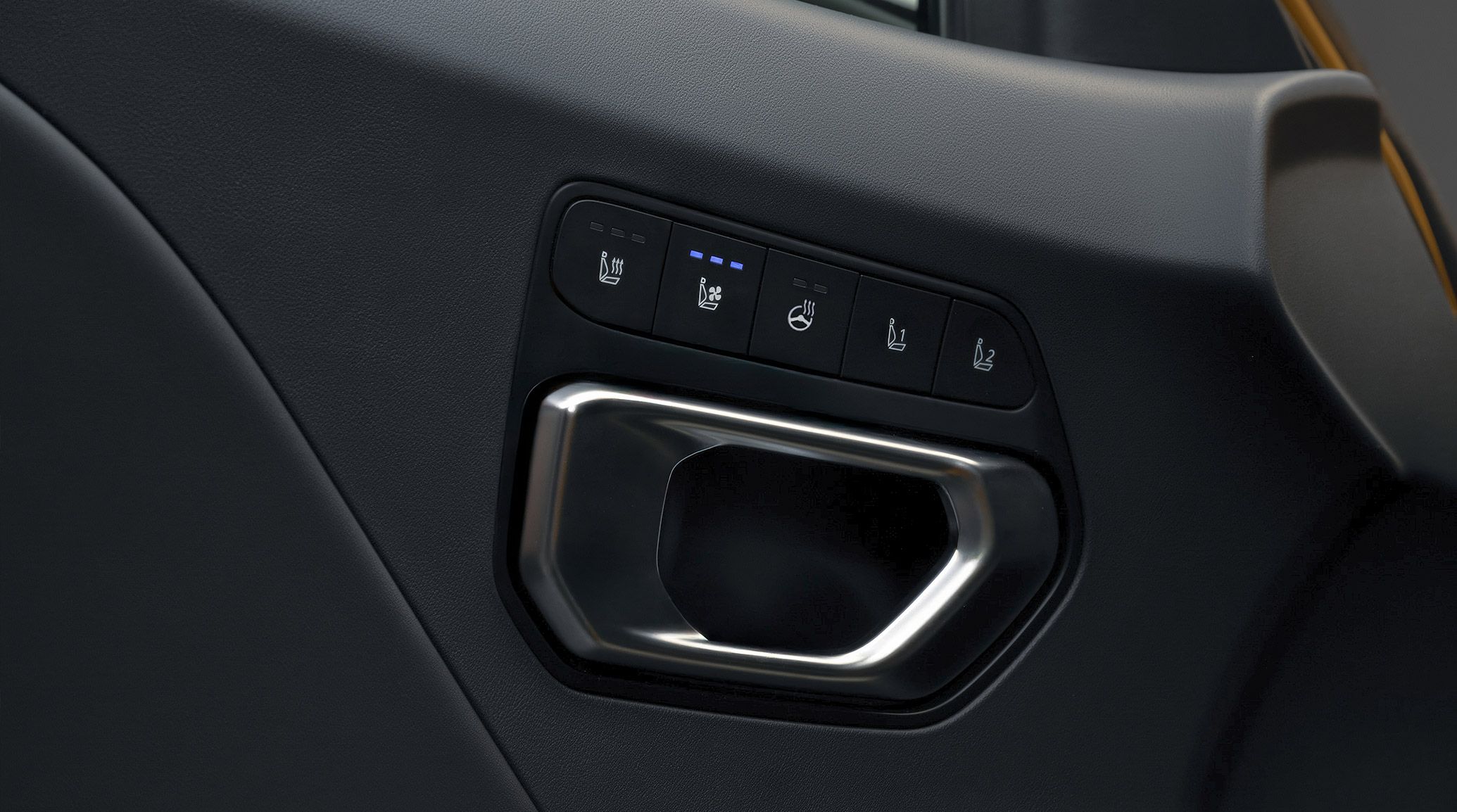 A close-up shot of the 2026 K4 Hatchback interior in black, highlighting the heated seat, ventilated seat, heated steering wheel, and driver’s memory seat controls that are located above the door handle available on the GT-Line Turbo.