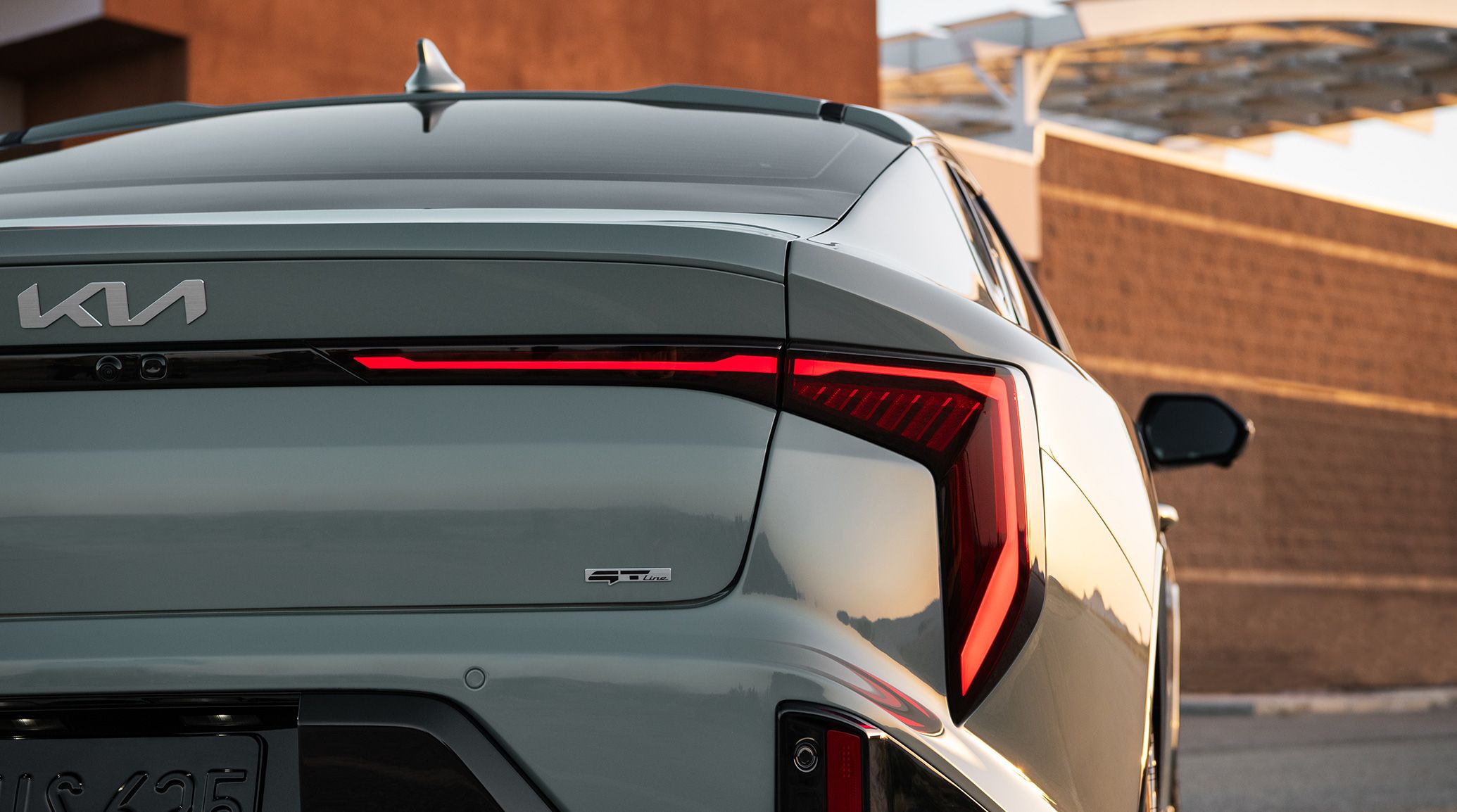2025 Kia K4 LED taillights featuring both the Kia and GT-Line badge, close-up