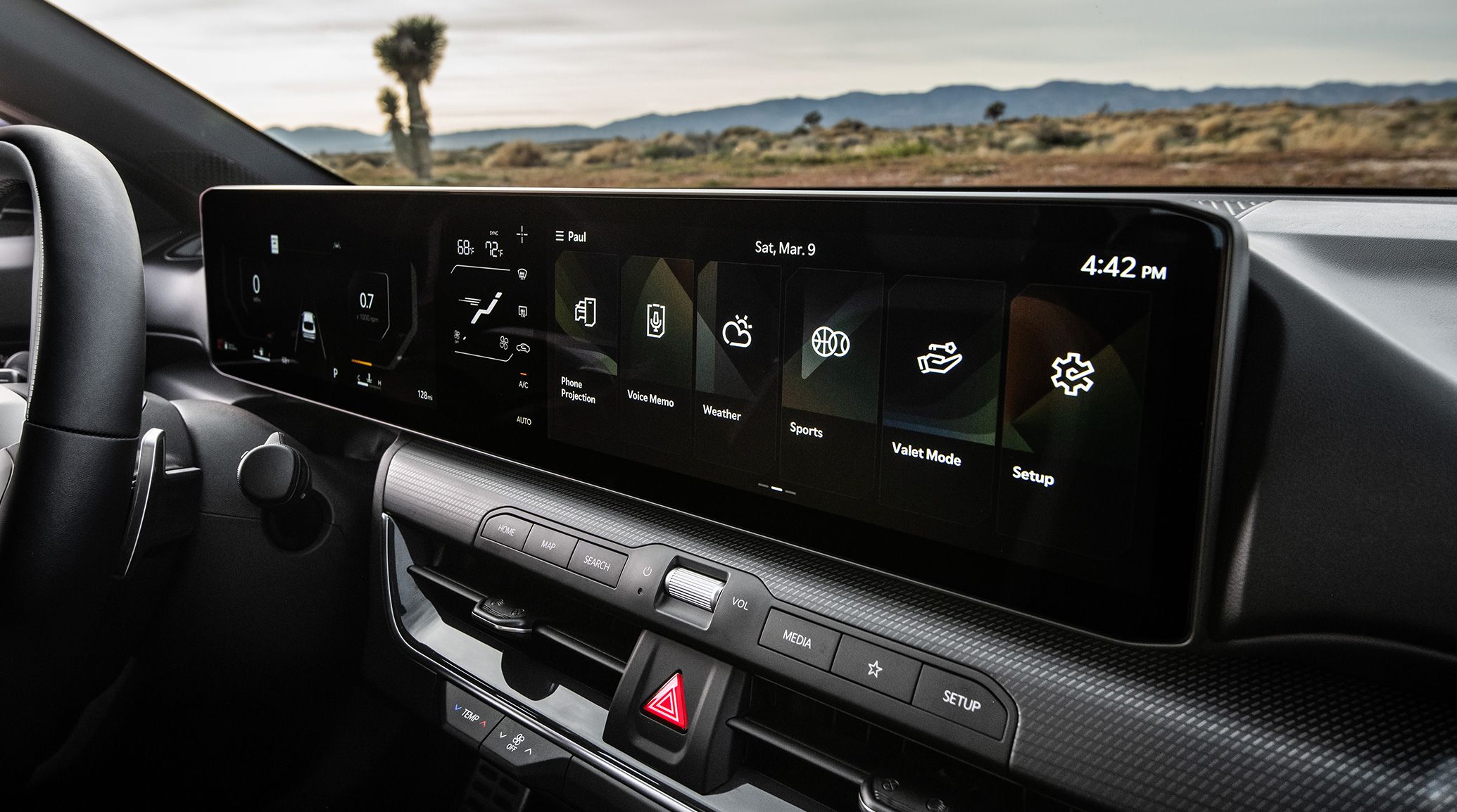 2025 Kia K4 widescreen display with a digital gauge cluster and entertainment apps, side-view