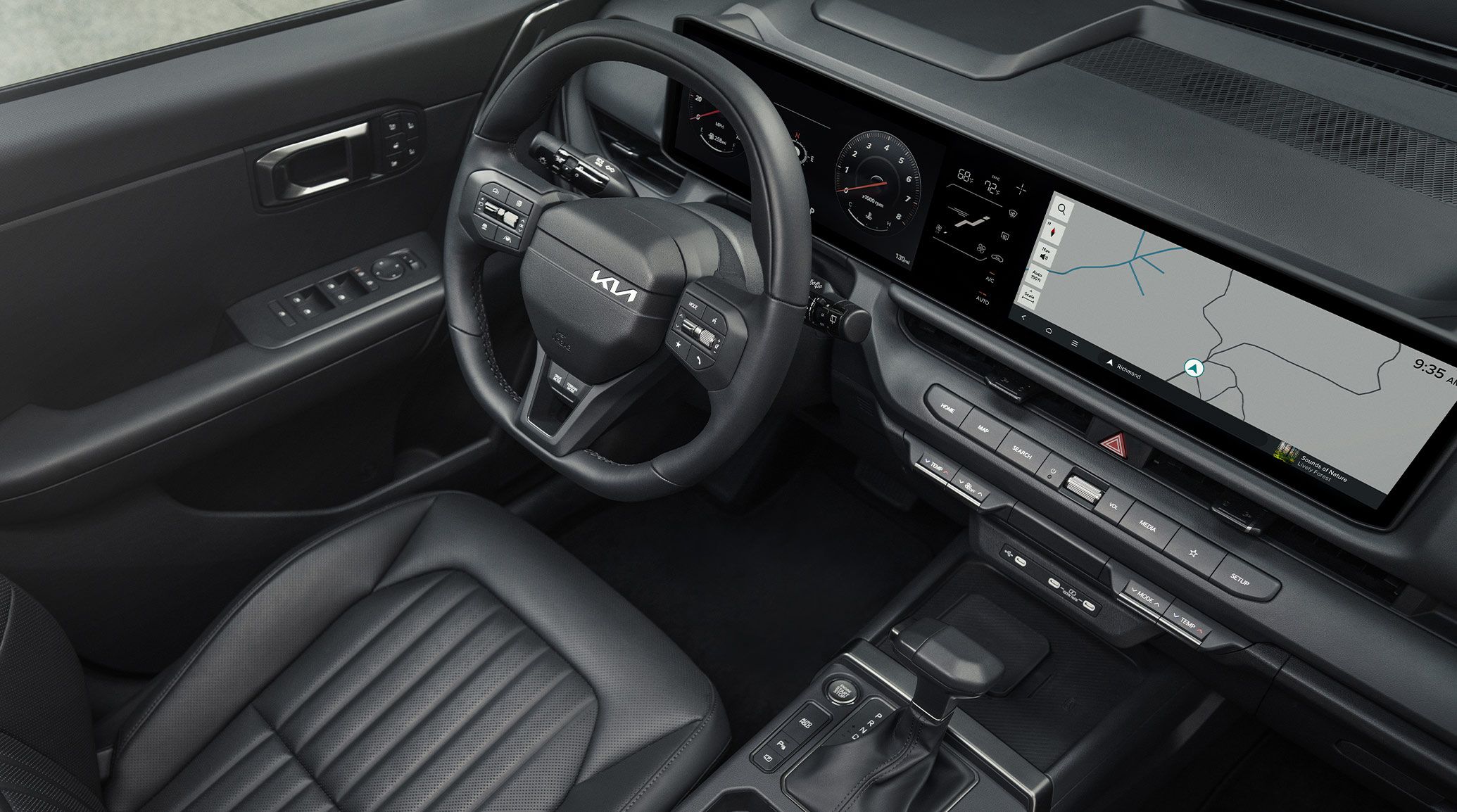 Angled upward view of the interior of the 2027 Kia Seltos SUV highlighting the leather driver seat, sleek leather-wrapped steering wheel, and digital display with maps shown.