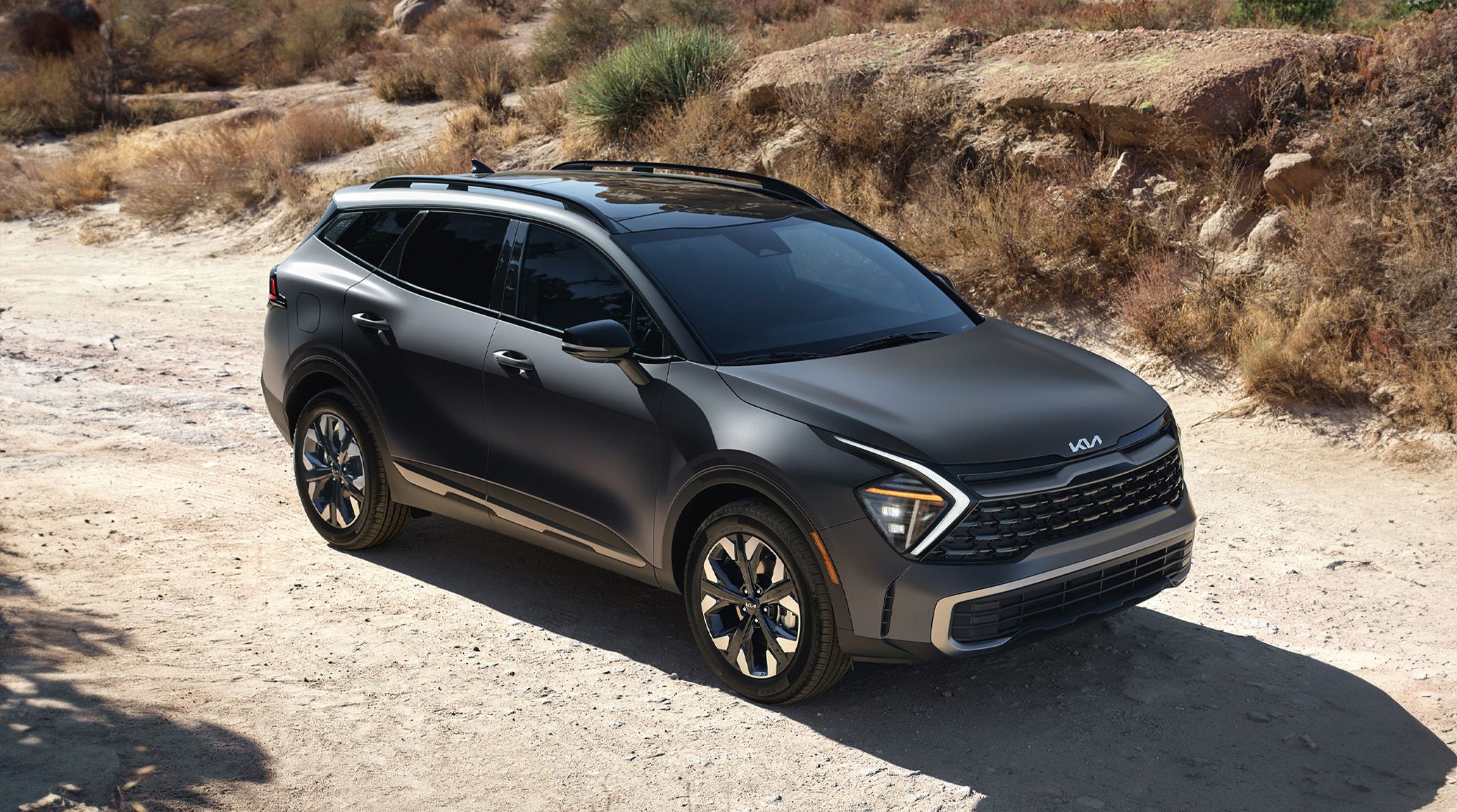 2024 Kia Sportage PHEV parked on beach. 
