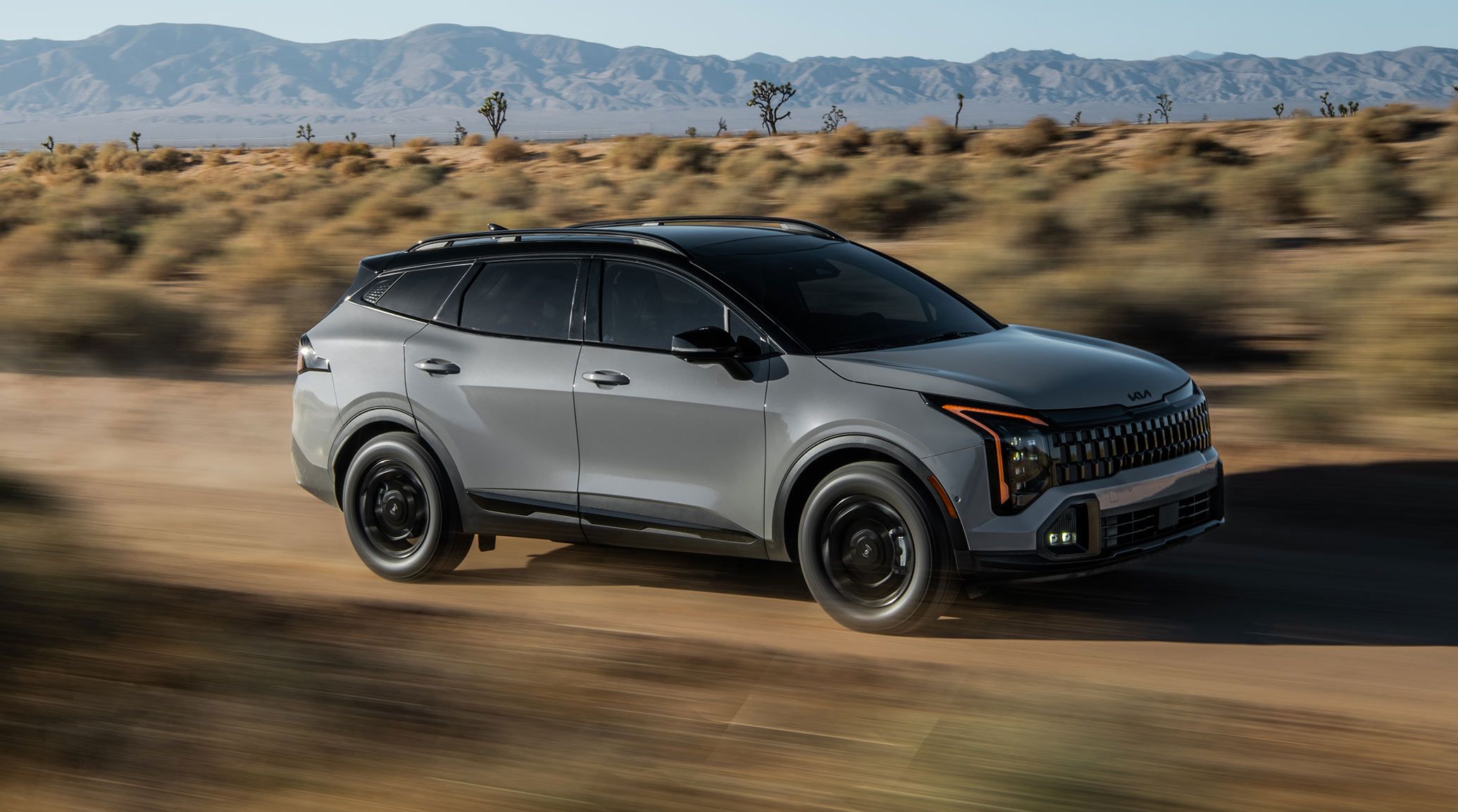 2027 Kia Sportage full side profile showing the 184.4-inch body and roof rails