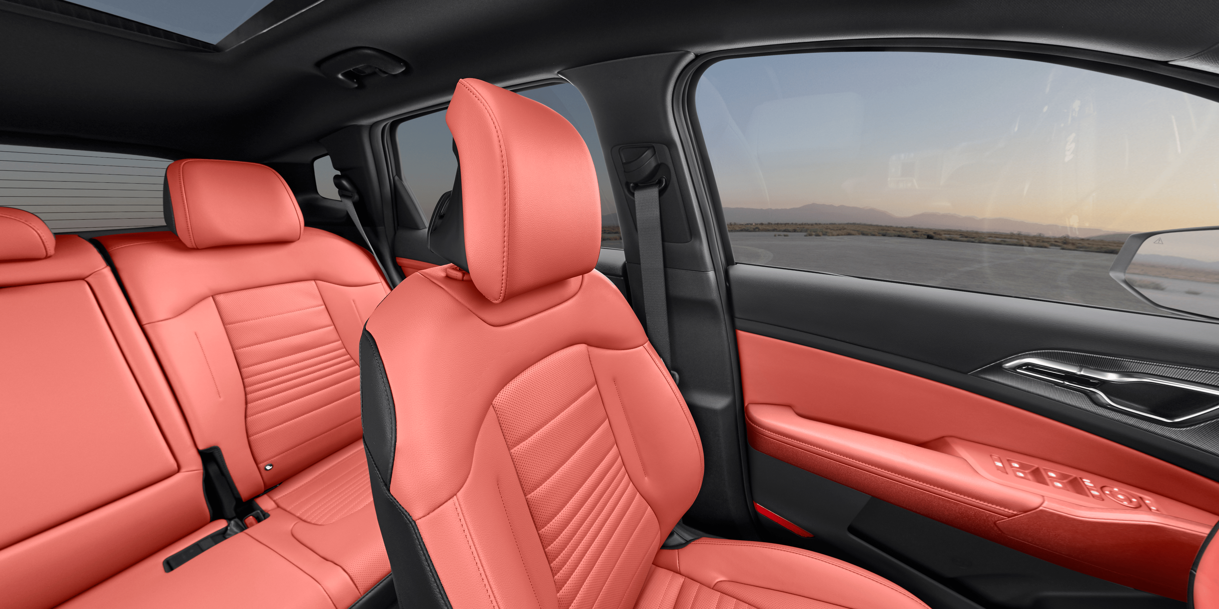 2027 Kia Sportage SX cabin in Carmine Red SynTex, viewed from the rear seat toward the dashboard