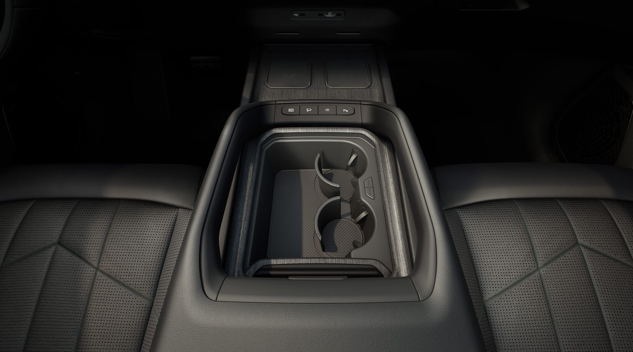 The 2027 Kia Telluride Hybrid SUV interior center console in black, with the premium seats and spacious cup holders highlighted.
