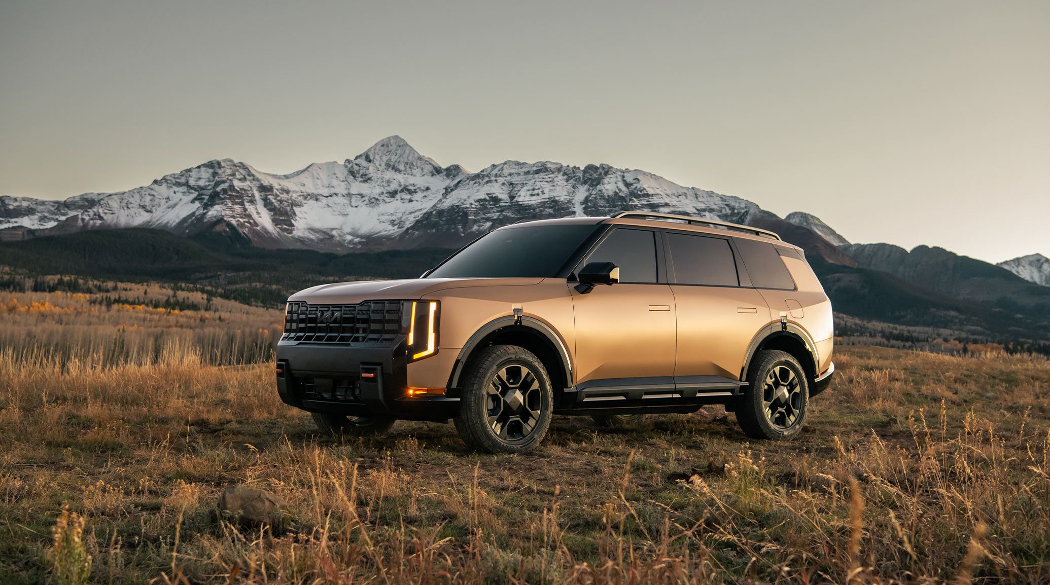  2027 Kia Telluride Driving through the mountains front view