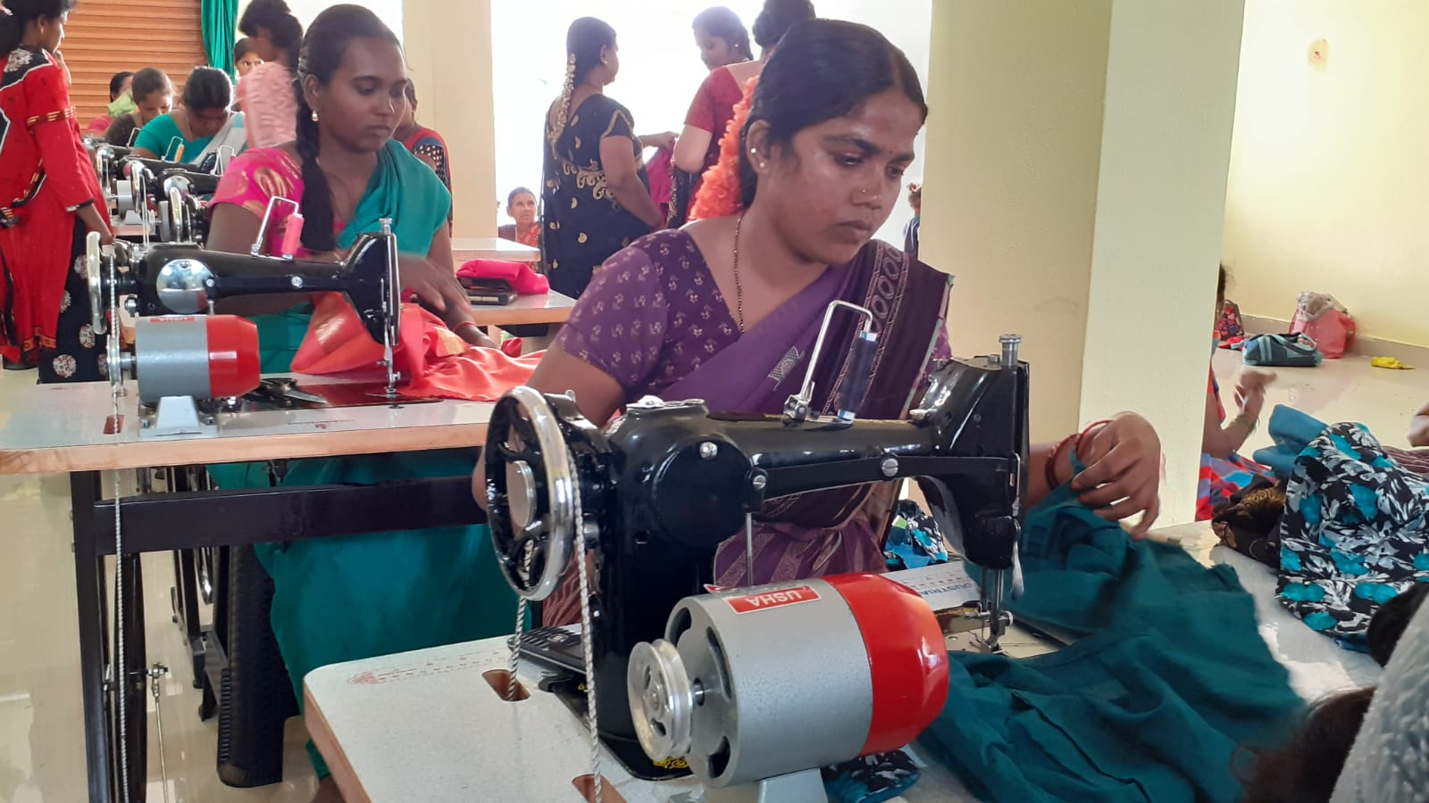 Front view of a white Kia Seltos SUV parked on a driveway