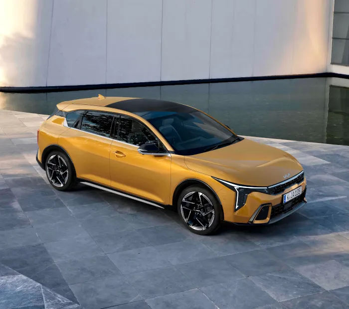 Kia K4 Hatch honeycomb yellow top down front three quarter view parked