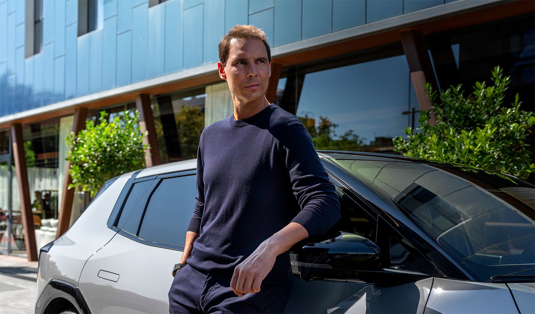 EV4 and Rafael Nadal standing next to the EV4.