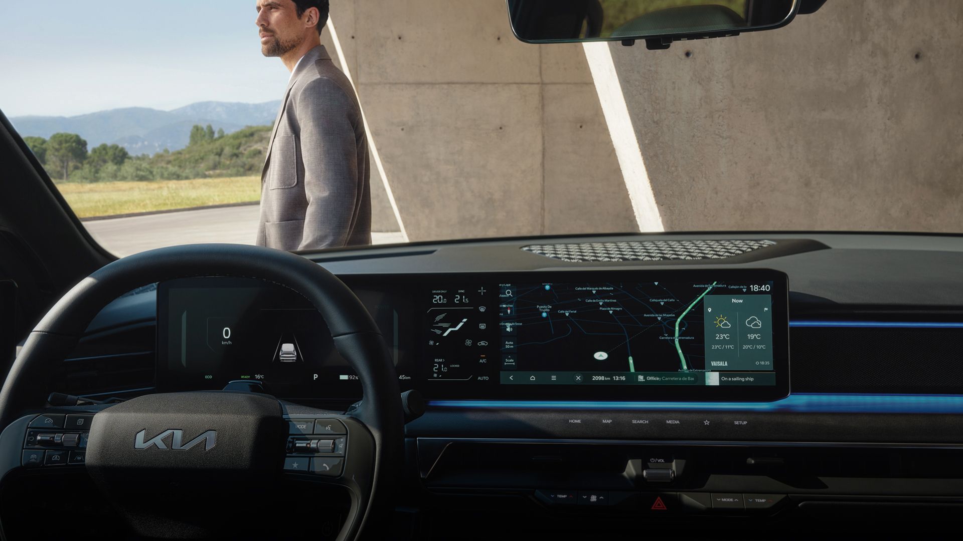 Cockpit view with navigation screen and a person standing outside