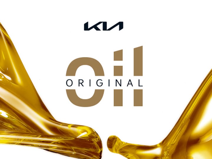 Mechanic showing the customer different oil types