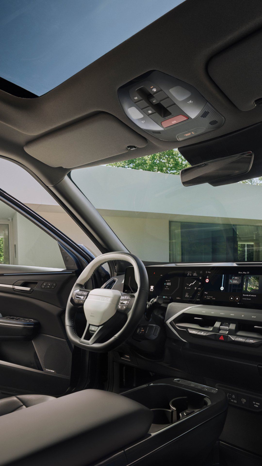 Kia vehicle interior showing the overhead SOS button