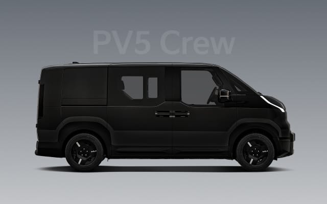 Side view of the black Kia PV5 Crew with tinted windows