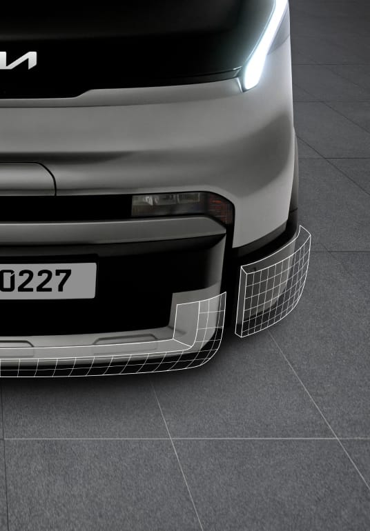 Close-up of the Kia PV5 Cargo front bumper and lower grille