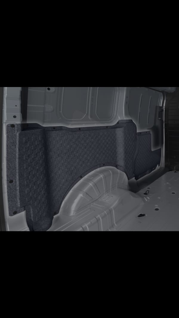 Primer plano del panel de pared lateral interior del Kia PV5 Cargo