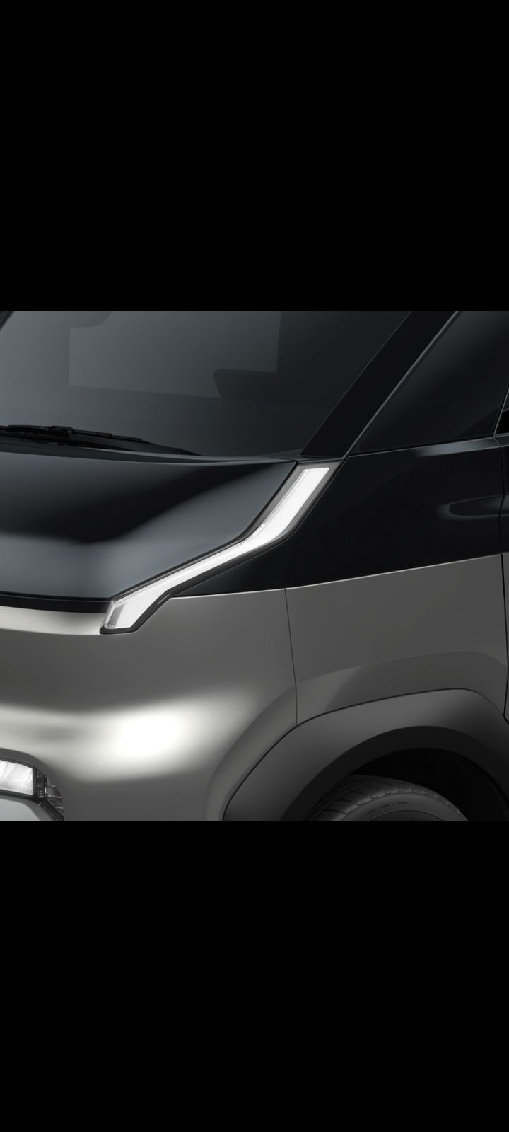 Close-up of the Kia PV5 Cargo front headlight and hood design