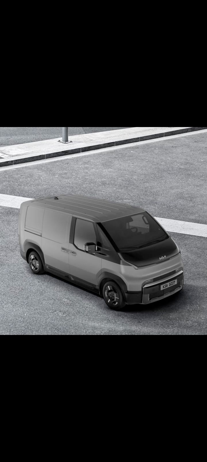 Angled front-side view of the Kia PV5 Cargo with roof rack installed