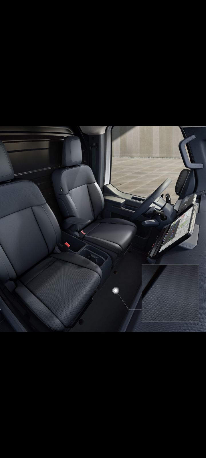 Close-up of the Kia PV5 Cargo interior floor with durable carpeting