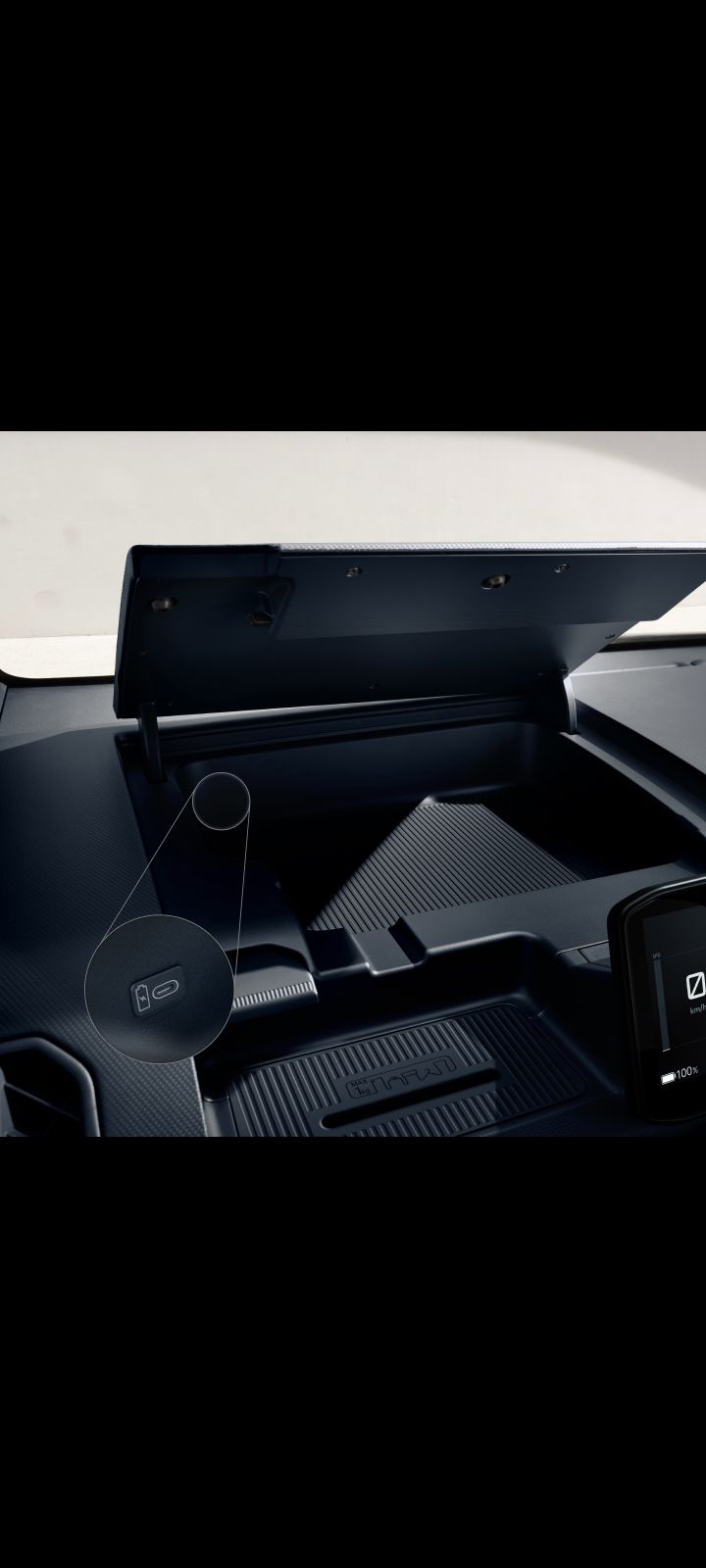 Dashboard storage compartment of the Kia PV5 Cargo being opened