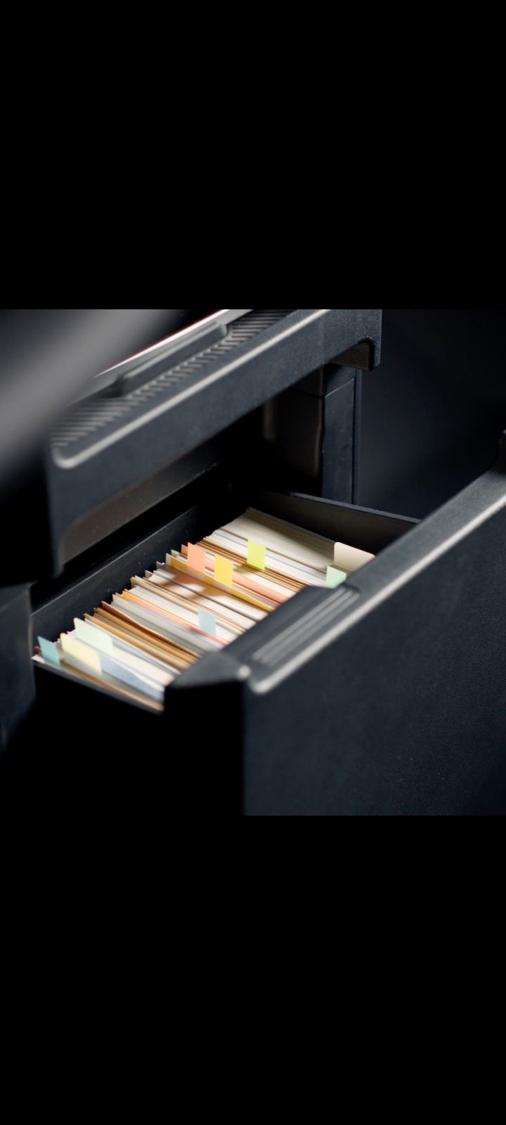 Centre console drawer of the Kia PV5 Cargo with files stored inside
