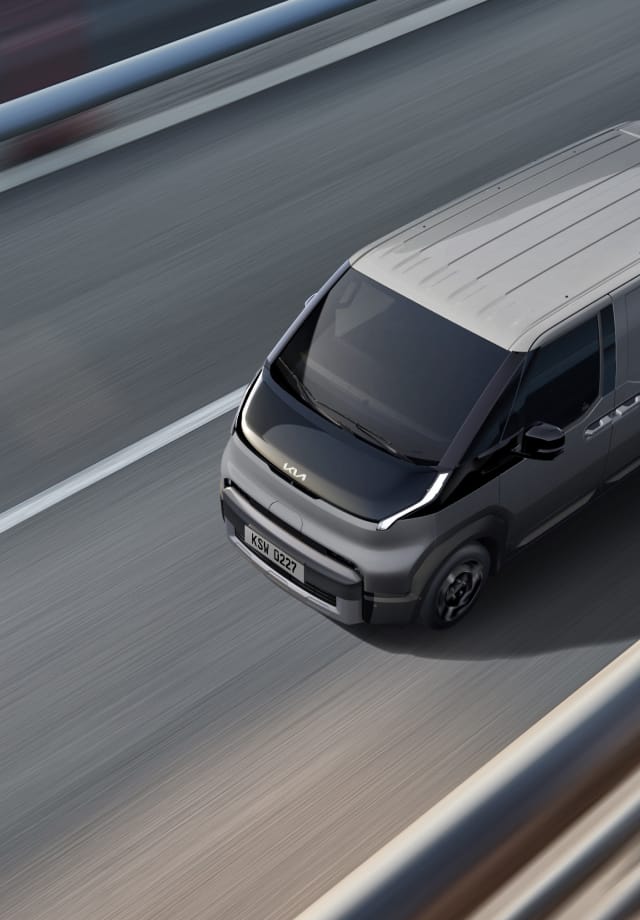 Top view of the Kia PV5 Cargo driving on highway