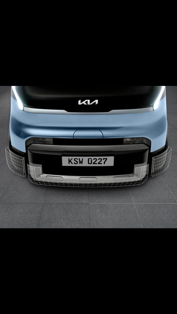 Front close-up of the Kia PV5 Passenger bumper showing three-piece repair structure