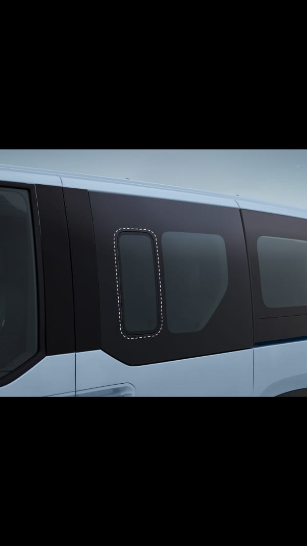 Close-up of the Kia PV5 Passenger flush glass window with seamless design