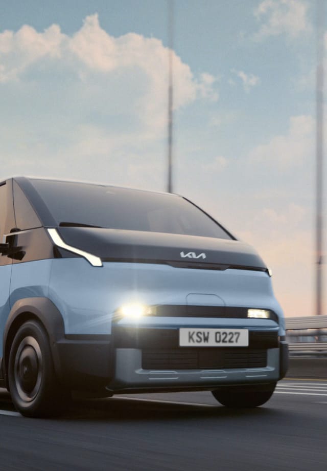 Top view of the Kia PV5 Passenger driving on a highway