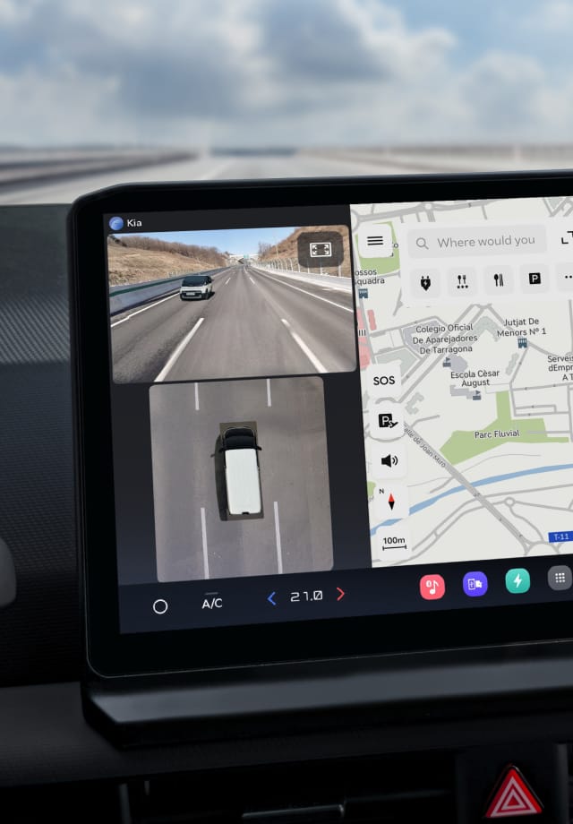 Close-up of the infotainment screen showing a navigation map and rear camera view