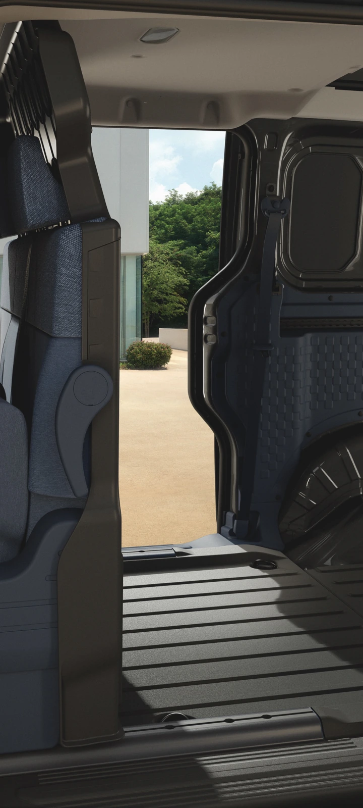 Interior of the Kia PV5 Crew Van with seats folded for cargo space