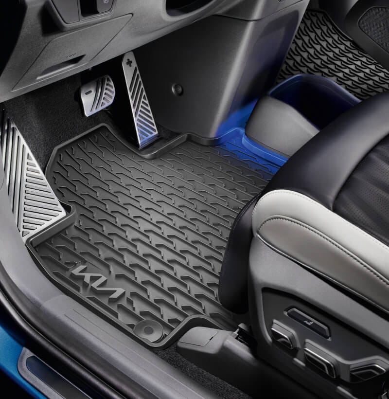 Kia All-Weather Floor Mats perfectly fitted in a Kia EV9 to protect the cabin from dirt and moisture.