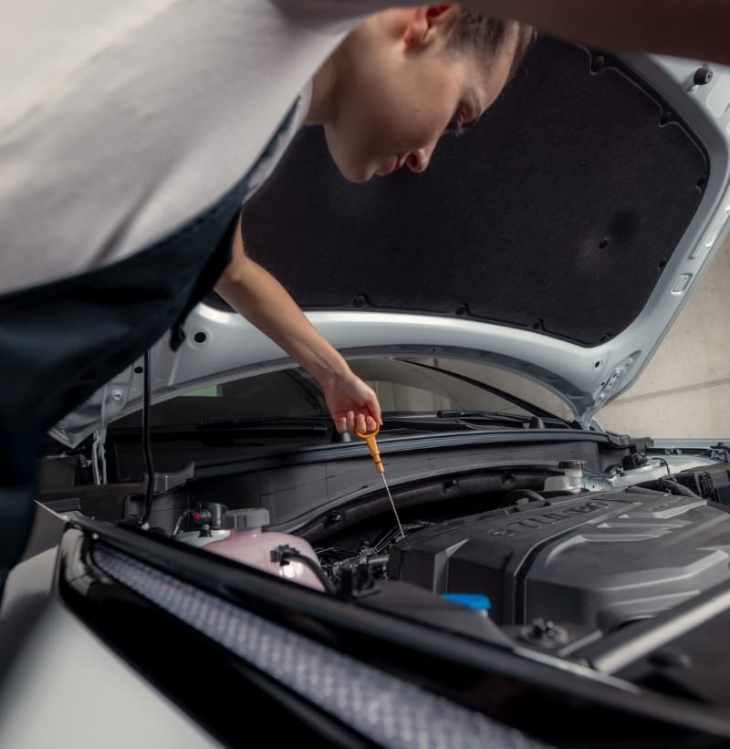 Kia Technician checking the coolant level as part of the Kia EV Health Check.