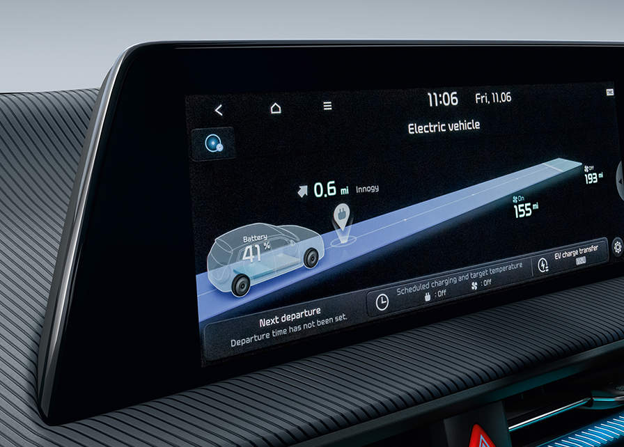 The infotainment system inside a Kia Electric Vehicle showing battery percentage, range and closest EV charging point.	