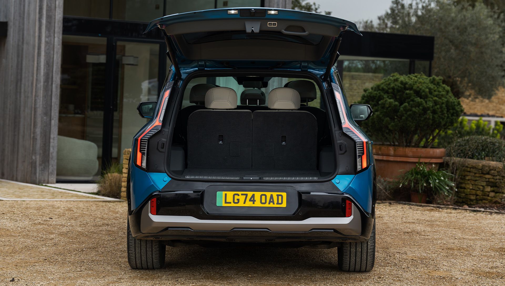 Kia EV9 front and bicylist