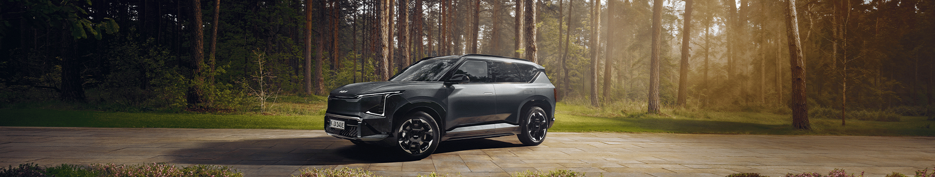 The Kia EV5 in a forest