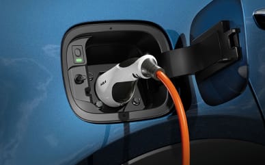 A detailed charging plug on electric car