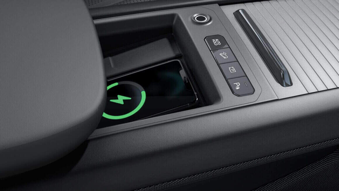 The charging port is centrally located in the car's console.