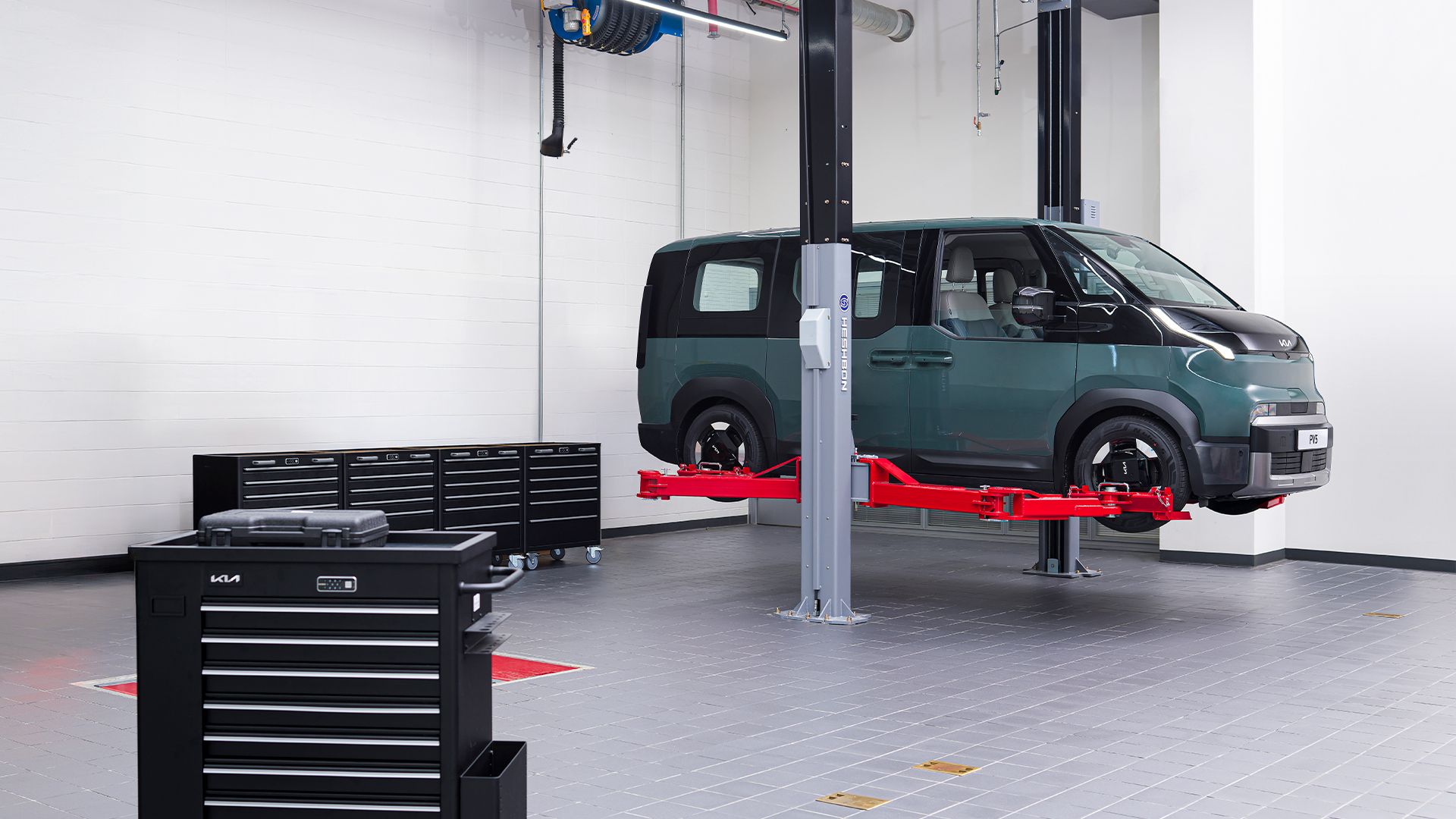Kia PV5 on a PBV-dedicated service bay lift