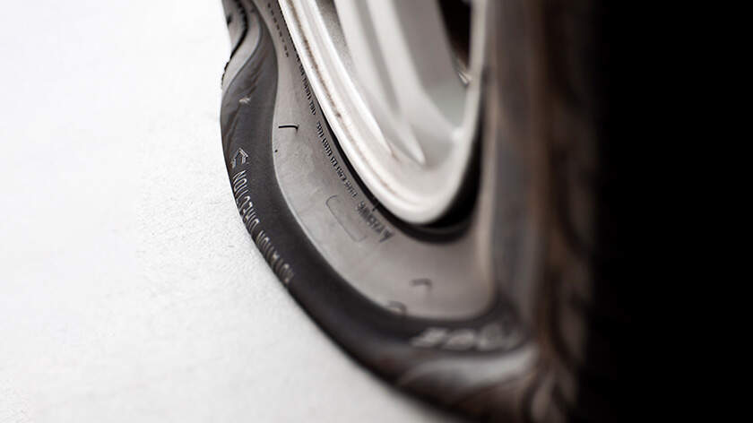 Close-up of a flat tyre