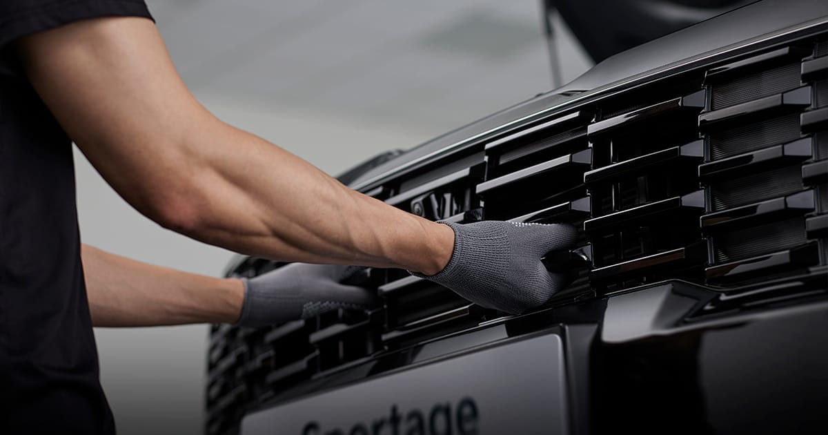 Man fitting a grille 