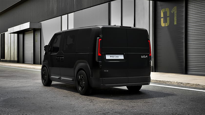Black Kia PV5 Crew van parked on a city street