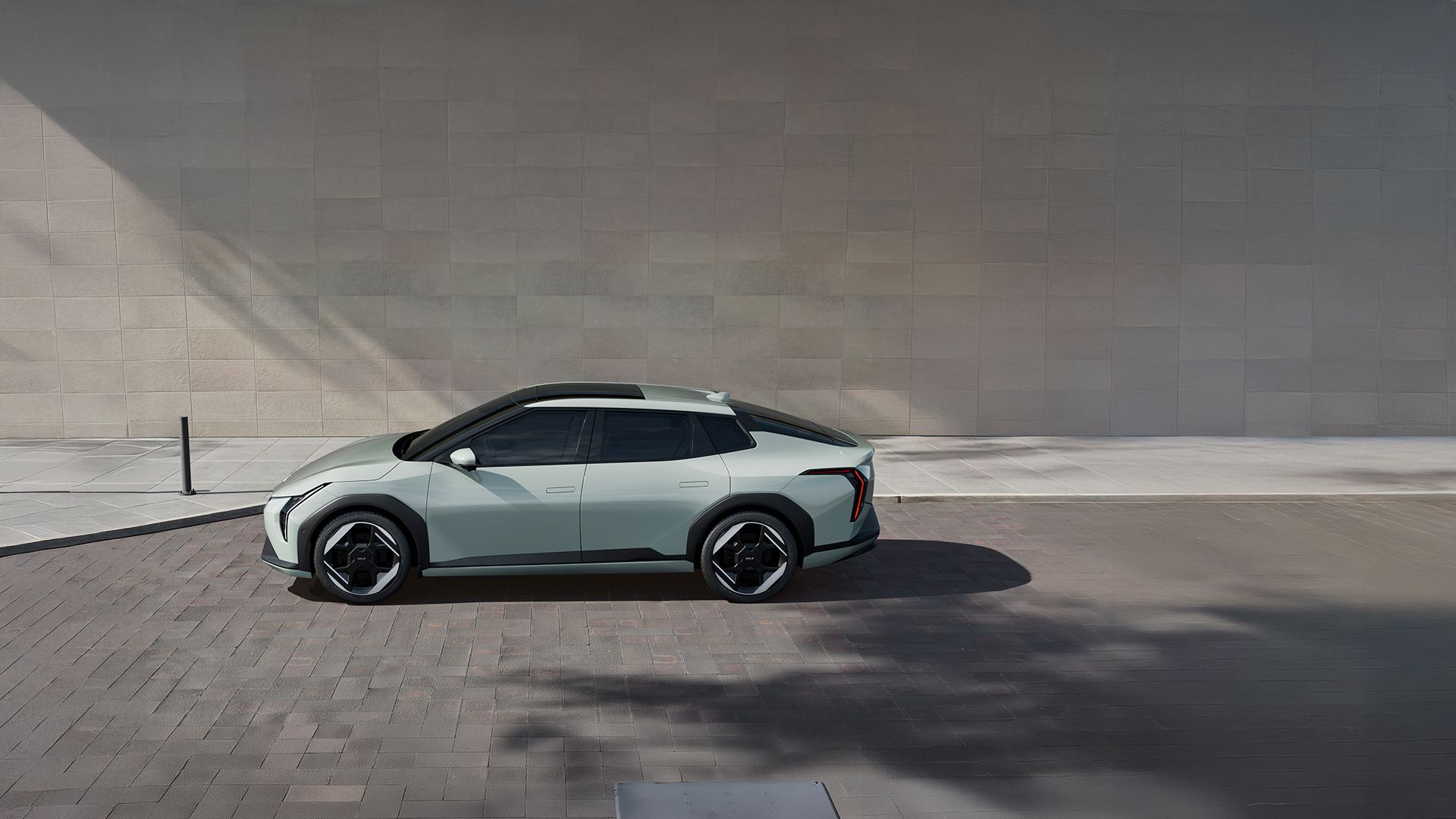 Side view of a parked Kia EV4 on a street