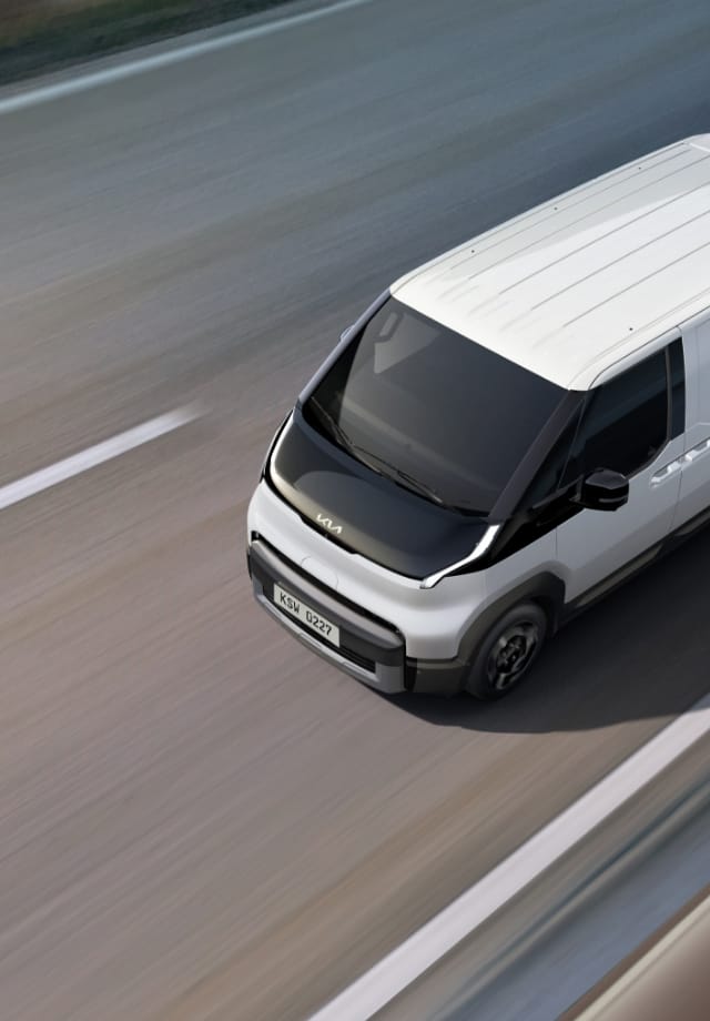 Top view of the Kia PV5 Cargo driving on highway