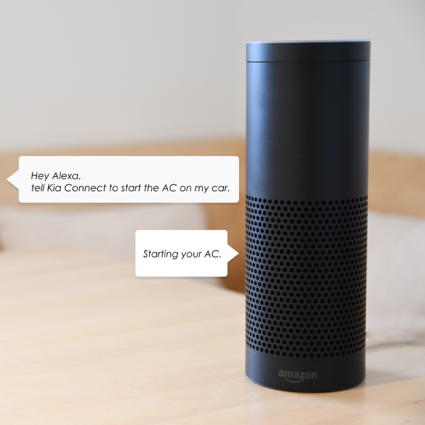 A black Amazon Alexa on a table responding to a command to start the AC in the car with Kia Connect
