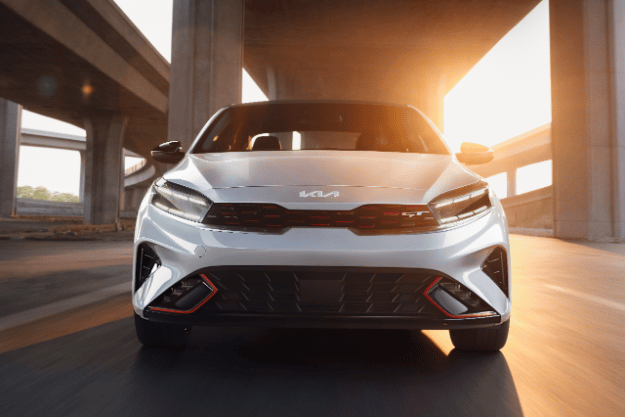 2022 Kia Forte in gray, full front view showcasing the stylish new Kia logo
