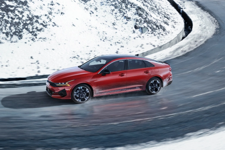 2022 Kia K5 GT-Line Driving In Snowy Conditions Side View
