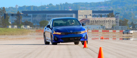 2022 Kia K5 GT Driving Through A Slalom Course With Precise Handling Front View